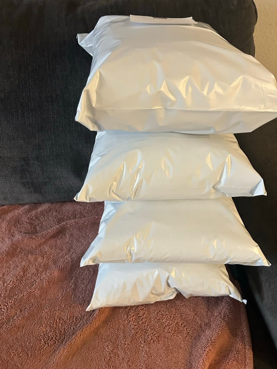 Sealed mailers stacked and ready for USPS